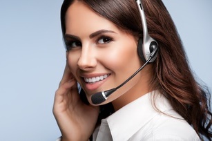 customer support phone operator in headset, with blank copyspace area for slogan or text message, over grey background. Consulting and assistance service call center.